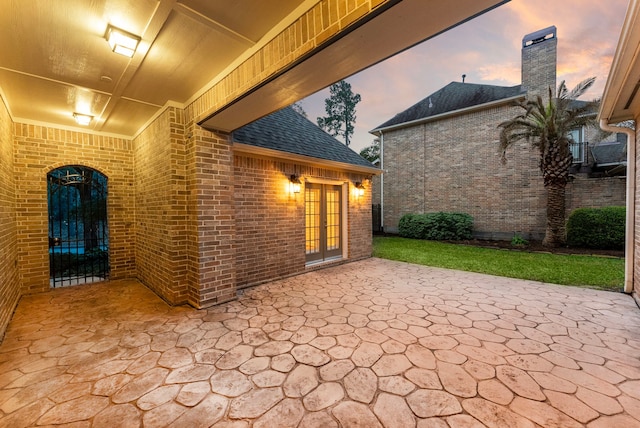 patio terrace at dusk with french doors