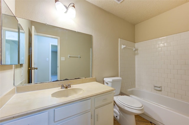 full bath featuring toilet, tile patterned floors, a textured ceiling, vanity, and shower / bathing tub combination