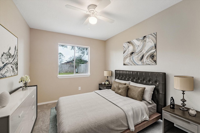 carpeted bedroom with baseboards and ceiling fan