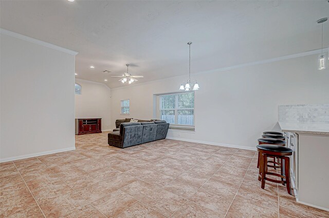 living area featuring crown molding, baseboards, and ceiling fan with notable chandelier