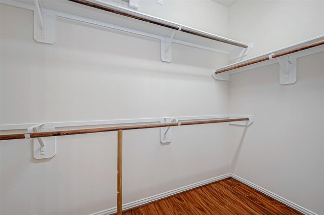 spacious closet with wood finished floors