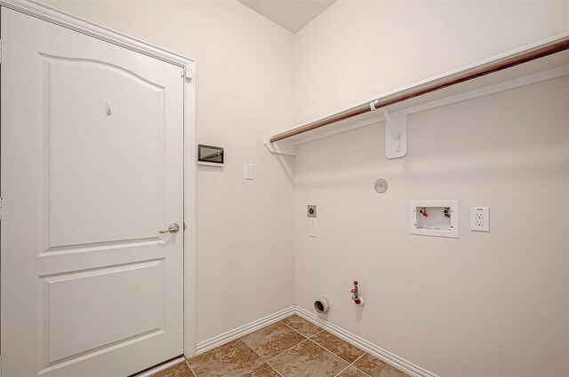 washroom featuring laundry area, baseboards, hookup for a gas dryer, hookup for a washing machine, and hookup for an electric dryer