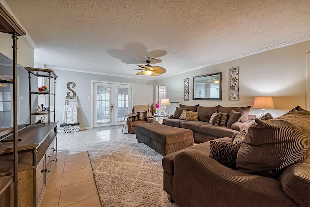 living room featuring light tile patterned floors, a ceiling fan, french doors, a textured ceiling, and crown molding