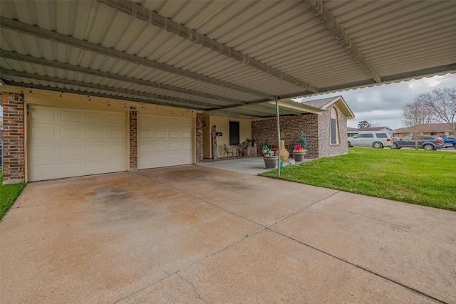 garage featuring a carport and driveway