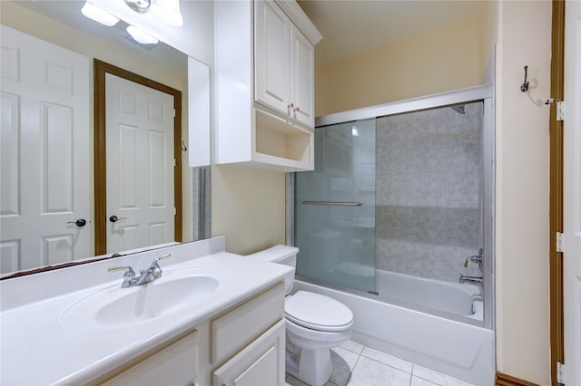 bathroom with tile patterned flooring, bathtub / shower combination, vanity, and toilet