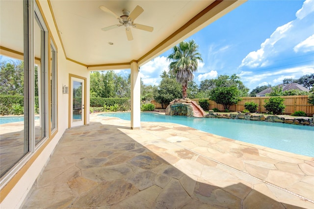 view of swimming pool with a patio, a fenced backyard, a ceiling fan, and a fenced in pool