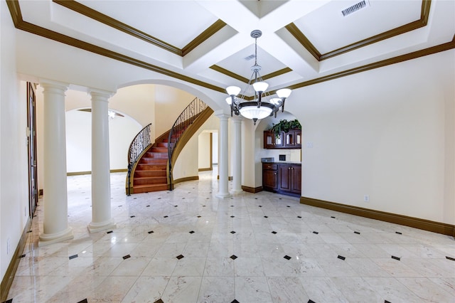 spare room featuring coffered ceiling, visible vents, and ornate columns