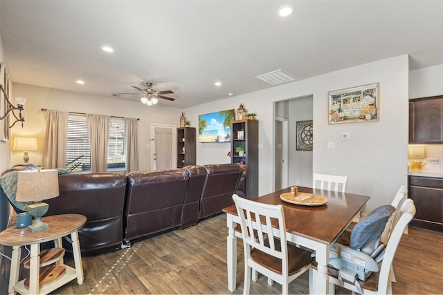 dining area featuring dark wood-type flooring, recessed lighting, visible vents, and a ceiling fan