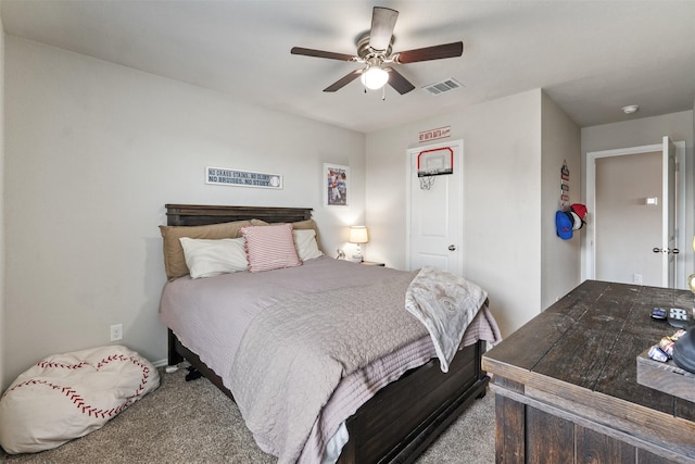 bedroom with ceiling fan, visible vents, and carpet flooring