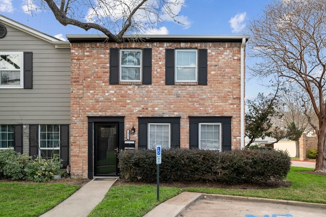 view of property with brick siding