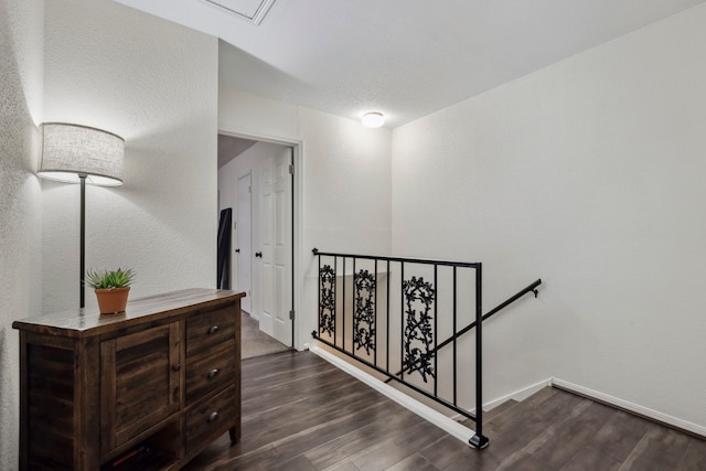 stairway featuring baseboards and wood finished floors