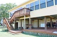 back of property featuring stairs
