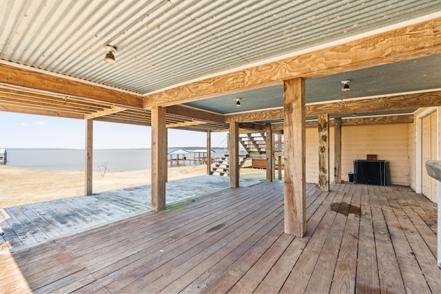 wooden deck with a water view