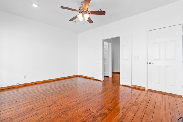 unfurnished bedroom featuring recessed lighting, ceiling fan, baseboards, and hardwood / wood-style flooring