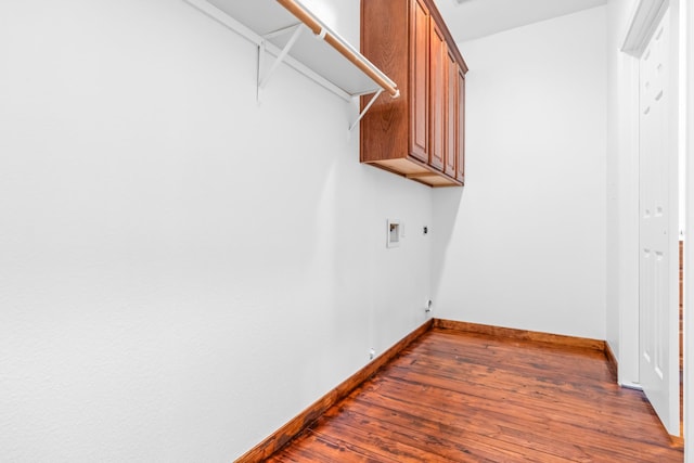 laundry room with gas dryer hookup, baseboards, washer hookup, and dark wood-style flooring