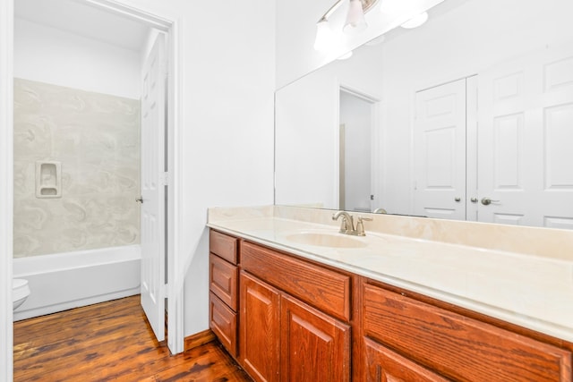 6930 W County Road 372, Jewett, TX 75846 - bathroom featuring vanity, wood finished floors, and toilet