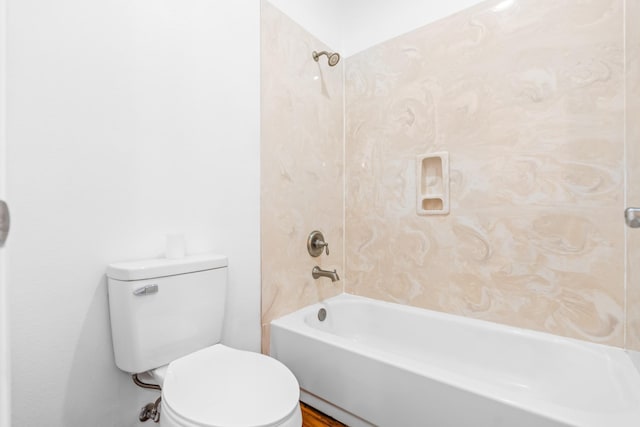 bathroom featuring toilet and  shower combination