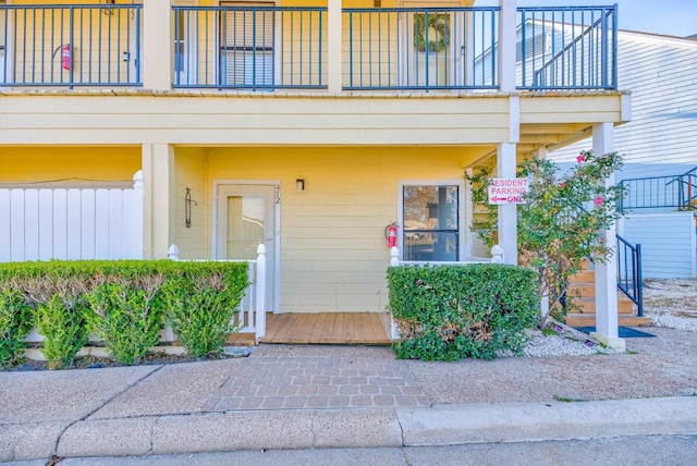 entrance to property with a balcony