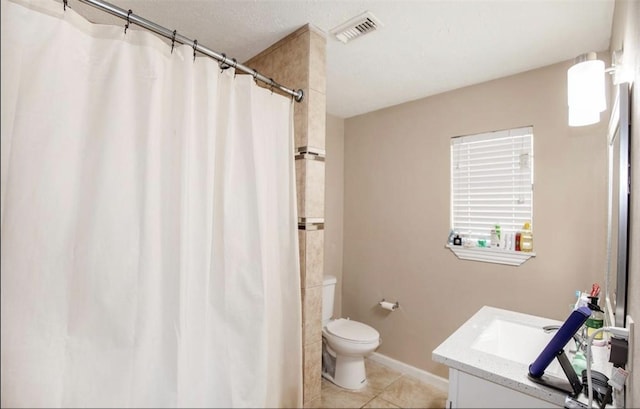 bathroom with visible vents, a shower with shower curtain, toilet, vanity, and tile patterned flooring