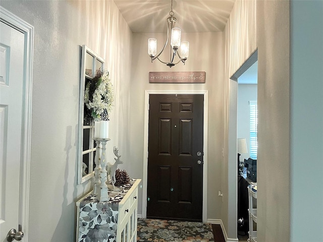 entryway featuring a chandelier