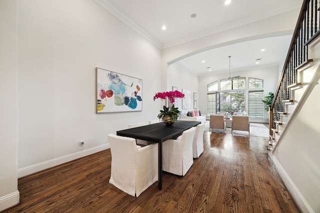 dining space with stairs, ornamental molding, dark wood finished floors, and baseboards