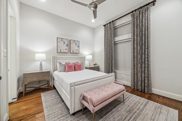 bedroom featuring a ceiling fan, recessed lighting, baseboards, and wood finished floors