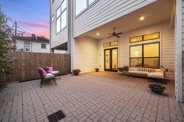 view of patio with french doors, visible vents, outdoor lounge area, fence, and ceiling fan