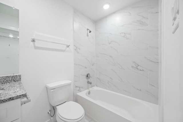 bathroom featuring toilet, vanity, and shower / tub combination