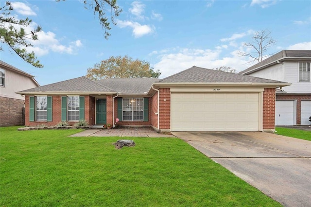 view of front of home featuring brick siding, a shingled roof, concrete driveway, an attached garage, and a front yard