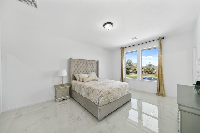 bedroom with marble finish floor, baseboards, and visible vents