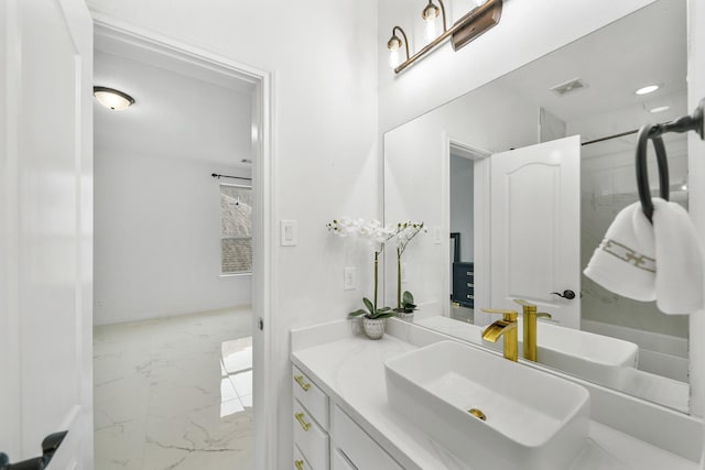 bathroom featuring marble finish floor, visible vents, and vanity