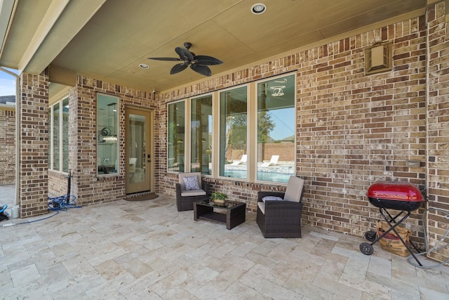 view of patio / terrace with a ceiling fan and area for grilling