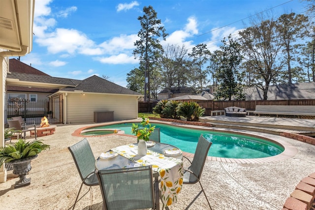 view of pool featuring an outdoor living space with a fire pit, a patio area, a fenced backyard, and a fenced in pool