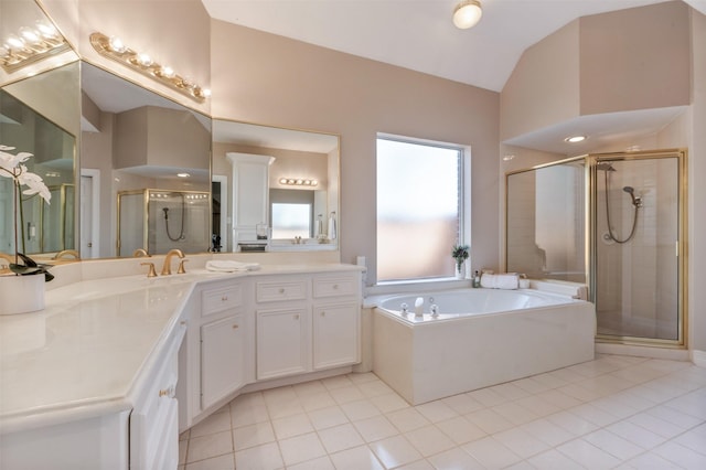 full bath with lofted ceiling, tile patterned flooring, a garden tub, vanity, and a stall shower