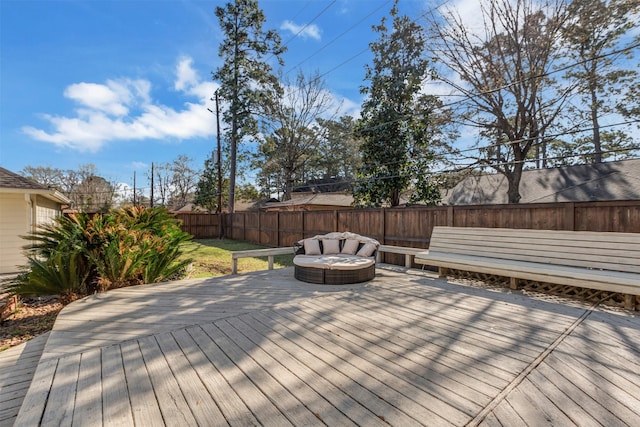 wooden terrace featuring a fenced backyard