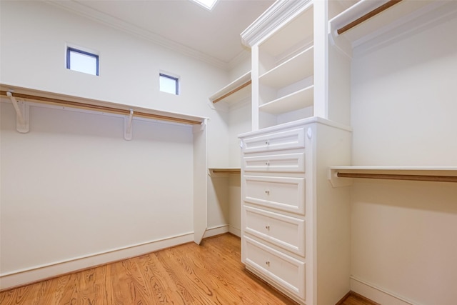 walk in closet featuring light wood finished floors