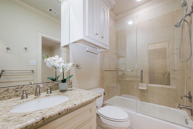 bathroom with visible vents, toilet, ornamental molding, shower / bath combination with glass door, and vanity