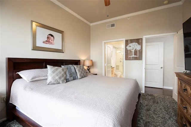 bedroom with visible vents, crown molding, ensuite bath, and ceiling fan