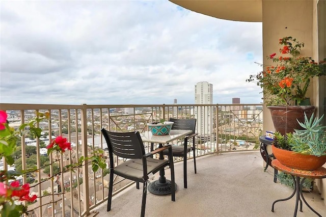 balcony featuring a city view