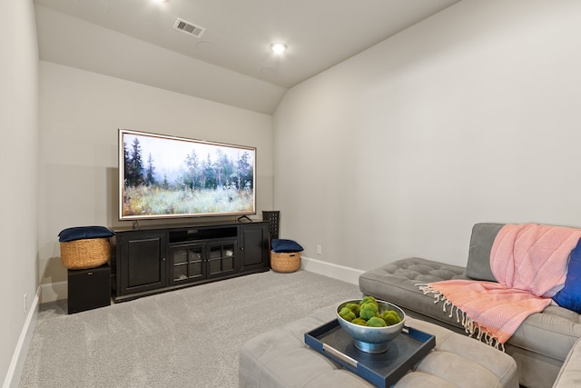 sitting room featuring carpet, visible vents, vaulted ceiling, and baseboards