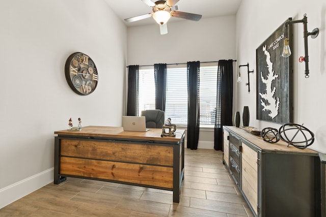 bedroom featuring light wood finished floors and baseboards