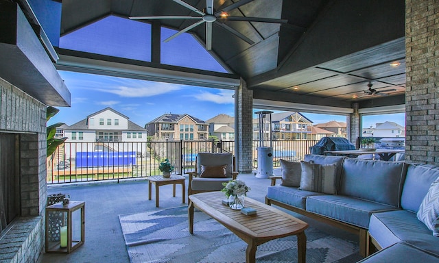 view of patio / terrace featuring ceiling fan, a residential view, an outdoor hangout area, and grilling area