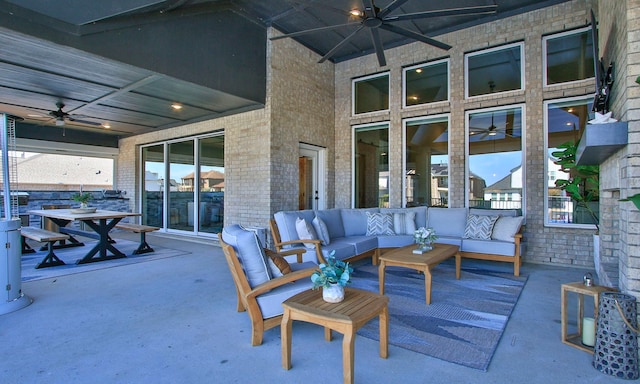 view of patio featuring a ceiling fan, outdoor dining area, and an outdoor hangout area