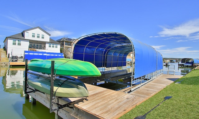 dock area featuring a water view and boat lift