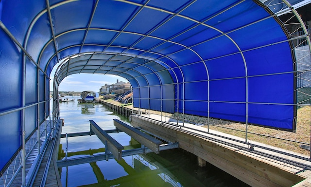 view of dock with a water view and boat lift