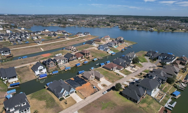 bird's eye view featuring a water view and a residential view