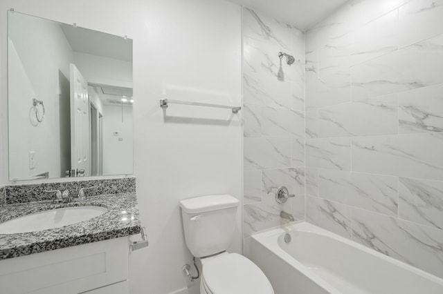 bathroom with washtub / shower combination, vanity, and toilet