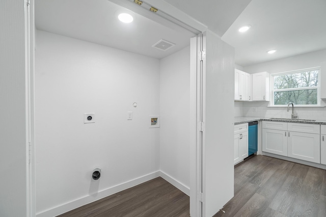 clothes washing area with baseboards, dark wood-style floors, electric dryer hookup, washer hookup, and a sink