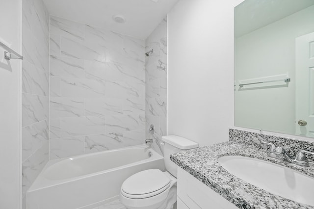 bathroom with washtub / shower combination, marble finish floor, vanity, and toilet