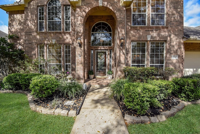 entrance to property with brick siding